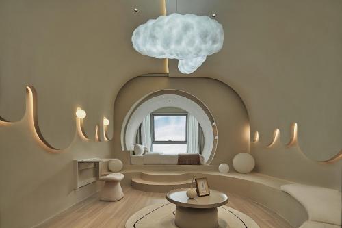 a room with a cloud hanging from a ceiling at Ziggy Hotel in Changsha