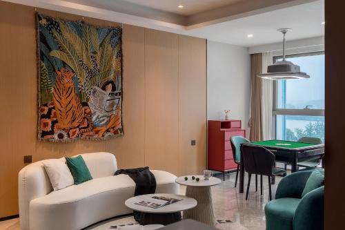 a living room with a couch and a table at Ziggy Hotel in Changsha