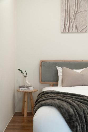 Ένα ή περισσότερα κρεβάτια σε δωμάτιο στο Cozy Homey Studios - Hoi an Coco Forest