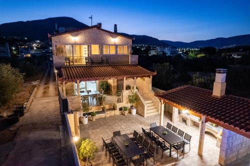 an aerial view of a house with a table and chairs at Villa Vegera in Anavissos