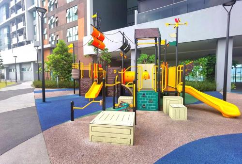 a playground with a slide in a building at MJ Homestay 99 Batu Caves KL North 99Residence 3R2B in Kuala Lumpur
