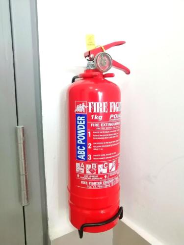 a red fire hydrant is sitting on a shelf at MJ Homestay 99 Batu Caves KL North 99Residence 3R2B in Kuala Lumpur