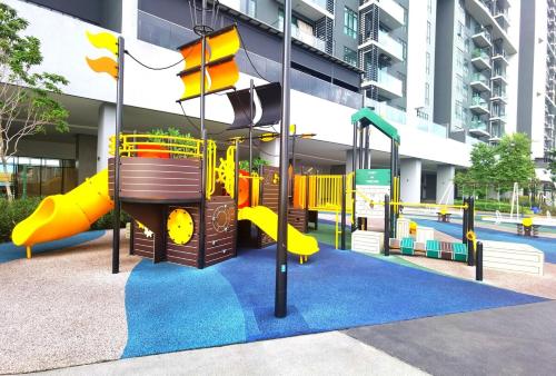 a playground in a building with a slide at MJ Homestay 99 Batu Caves KL North 99Residence 3R2B in Kuala Lumpur