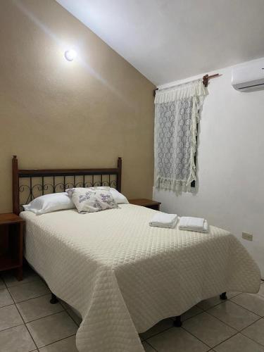 Ένα ή περισσότερα κρεβάτια σε δωμάτιο στο Katún boutique hotel