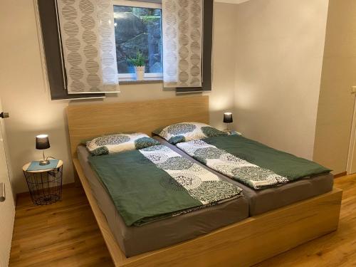 a bed in a room with a window at Ferienhaus Krämer in Kopp