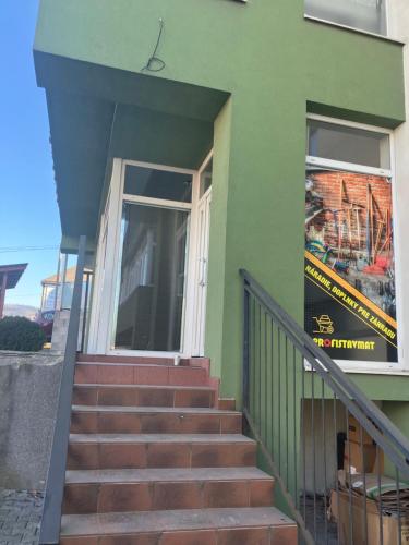 a stairway leading to a door of a building at Lacné ubytovanie Čadca in Čadca