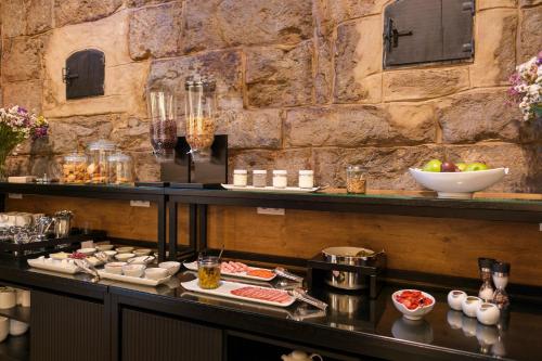 a buffet line with food on a table at Azores Book Hotel in Angra do Heroísmo