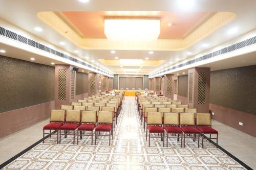 an empty room with chairs and tables in it at Stamps by Eight Continents, Jodhpur in Jodhpur
