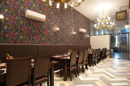 a dining room with a table and chairs at Stamps by Eight Continents, Jodhpur in Jodhpur