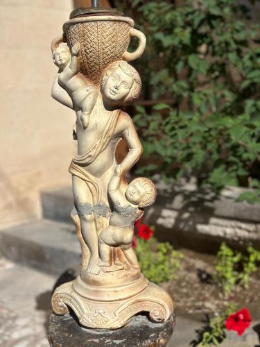a statue of a woman and a child holding a vase at Wish Cappadocia in Uchisar