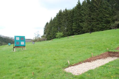 a sign in the middle of a green field at Ferienhaus Krämer in Kopp