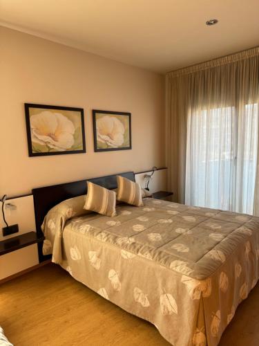 Postel nebo postele na pokoji v ubytování Apartamentos Turísticos Can Rocamora