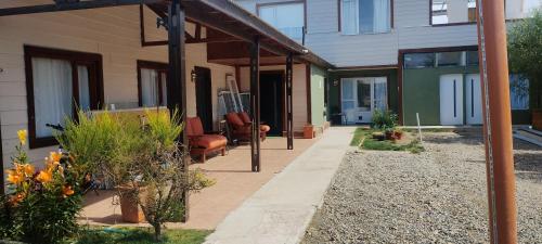 a porch of a house with plants on it at Freedom GALLE in Río Gallegos