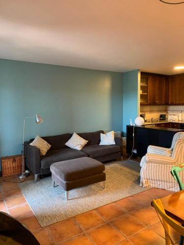 a living room with a couch and a table at Saldes Pedraforca in Saldés