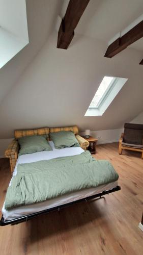 a bedroom with a bed in a attic at Central apartment in Buchholz idN in Buchholz in der Nordheide