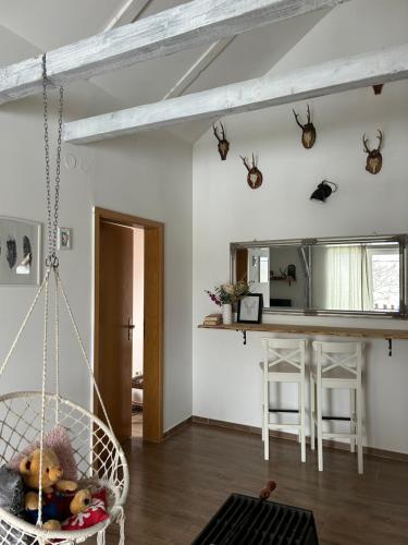 a room with a swing with a teddy bear in it at Planinski kutak in Lovinac