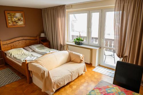 Postel nebo postele na pokoji v ubytování Pokoje Gościnne CYKADA