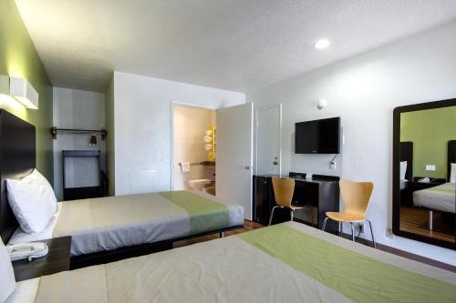 a hotel room with a bed and a desk at Motel 6-Santa Fe, NM - Downtown in Santa Fe