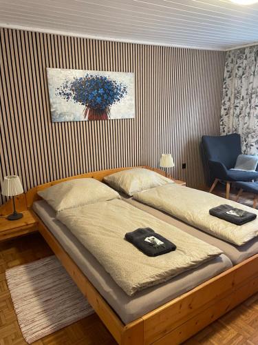 a bedroom with two beds with towels on them at Ferienhaus Karin in Schönabrunn