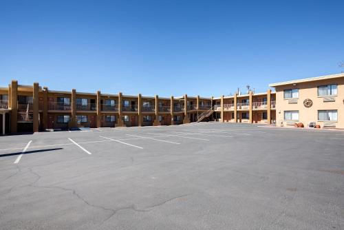 an empty parking lot in front of a building at Motel 6-Santa Fe, NM - Downtown in Santa Fe