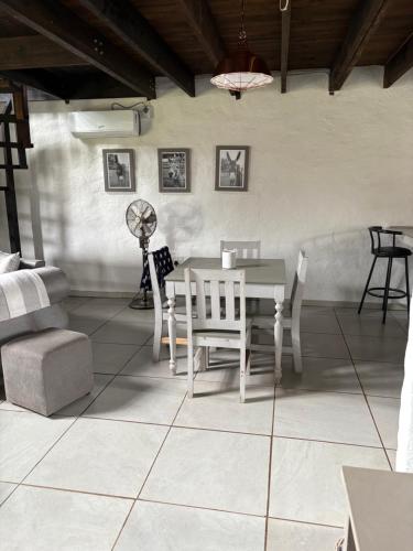 a dining room with a table and chairs at Le Soleil in Graskop