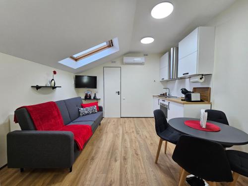 a living room with a couch and a table at ApartHotel Ritms in Krāslava