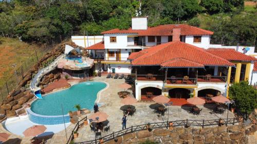 an aerial view of a resort with a swimming pool at Hotel Las Rocas Resort Villanueva in Villanueva