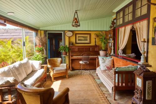 a living room with a couch and a table at TwoAngels in Knysna