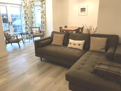 a living room with a couch and a table at Golfandbeach in Castlerock