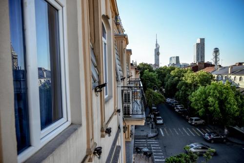 a view of a city street from a window at Black Sea Star Batumi in Batumi