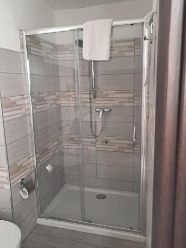 a shower with a glass door in a bathroom at Hotel Palace Gioia Tauro in Gioia Tauro