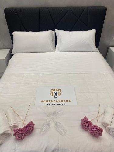 Ένα ή περισσότερα κρεβάτια σε δωμάτιο στο PORTACAPUANA Guest House