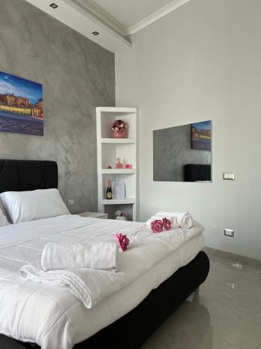 Ένα ή περισσότερα κρεβάτια σε δωμάτιο στο PORTACAPUANA Guest House