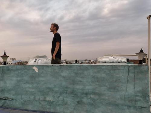a man standing on top of a wall at SA HAVELi in Bikaner