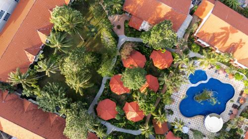 an overhead view of a garden with trees and a pool at Phuket Leelavadee Hua Ting Resort in Patong Beach