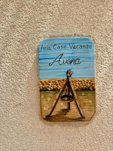 a sign on the wall with an aca case vazaaneaneaneane at Aria case vacanze in Favignana