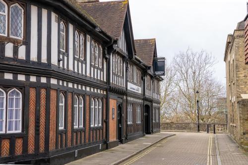 an old black and white building on a street at City Centre House in Southampton