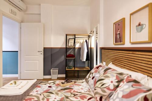 a bedroom with a bed and a closet at Savi Guest House metro B S Paolo in Rome