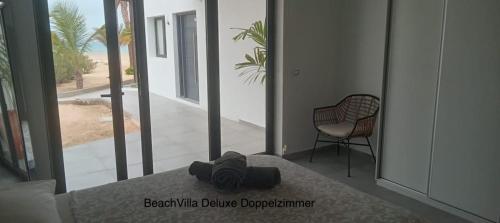 a view of a room with a table and a chair at Luxury Beach Villa, Praia de Chaves, Boa Vista in Boa Ventura