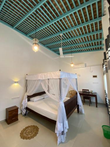 Giường trong phòng chung tại Villa Wasana - Galle