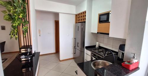 Kuchyň nebo kuchyňský kout v ubytování Sinta-se em casa!
