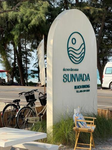a sign for a sun navaho sign with a chair at Sunvada Beach Rayong in Rayong