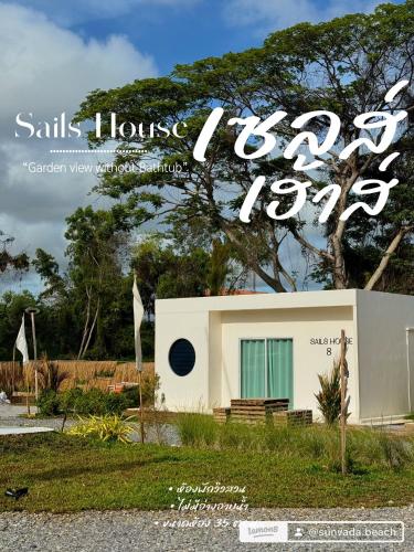 a house with a sign that says house tour at Sunvada Beach Rayong in Rayong
