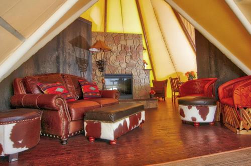 a living room with a couch and chairs and a fireplace at Westgate River Ranch Resort & Rodeo in River Ranch