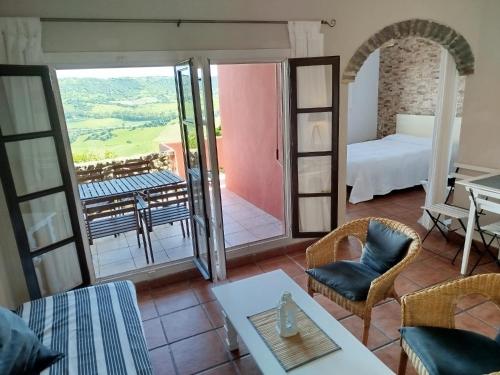 a room with a view of a bedroom and a bed at Casa Montecote Eco Resort in Vejer de la Frontera