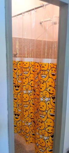 a glass door with a curtain with tigers on it at APARTAMENTO x 4 pessoas no VILLAGE DAIANE TAQUARY Guaibim Valença Bahia in Valença