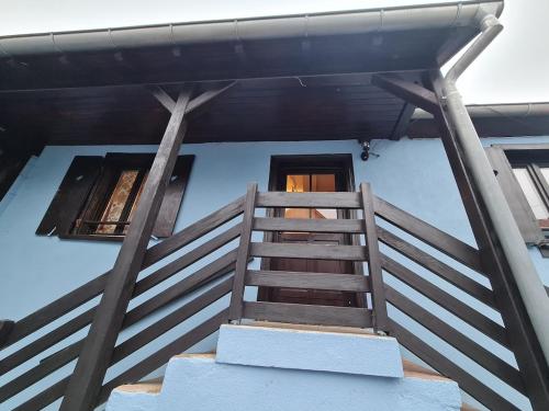 a staircase leading up to a house with a door at Gîte La Ferme des Délices in Epfig