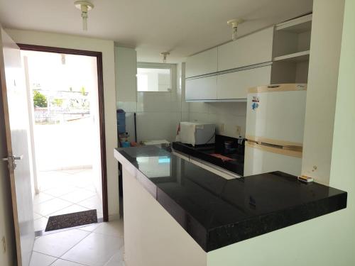 Η κουζίνα ή μικρή κουζίνα στο Apartamento em Jacumã - Edifício Mar & Sol Residence