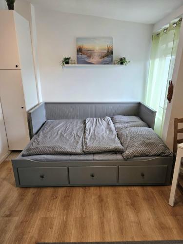 a bedroom with a bed in a room at Studio Bohaterów Monte Cassino in Sopot