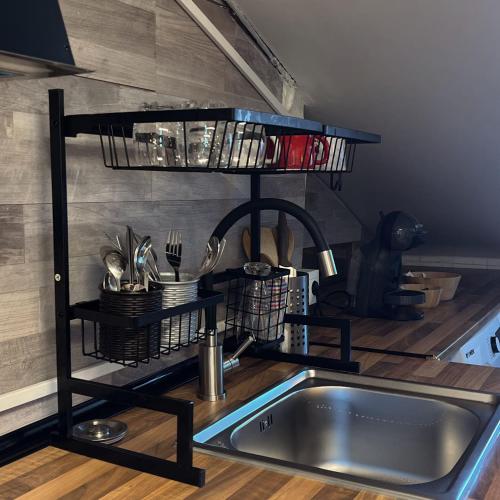 a shelf over a sink in a kitchen at Calera 2 in Burgos